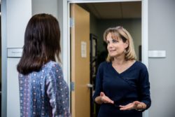 Prep office manager talking to a parent