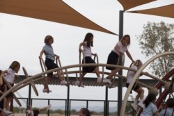 kids climbing on playground equipment